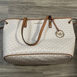Michael Kors tote white and brown. With wrist strap included
